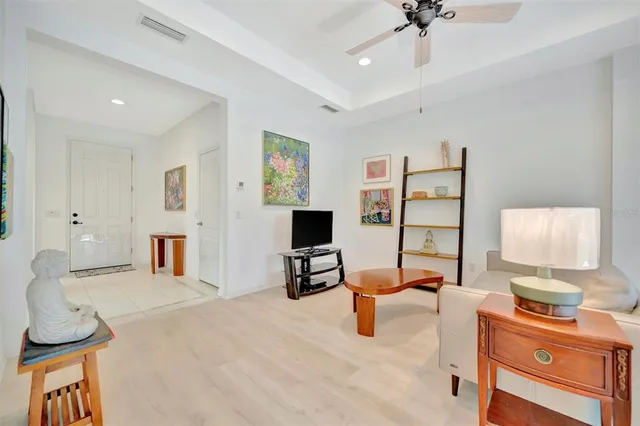 a kitchen with stainless steel appliances granite countertop a sink dishwasher and a dining table with kitchen view