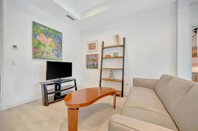 a kitchen with kitchen island a sink stainless steel appliances and cabinets