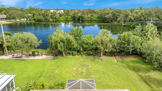 a view of a lake with a house in the background