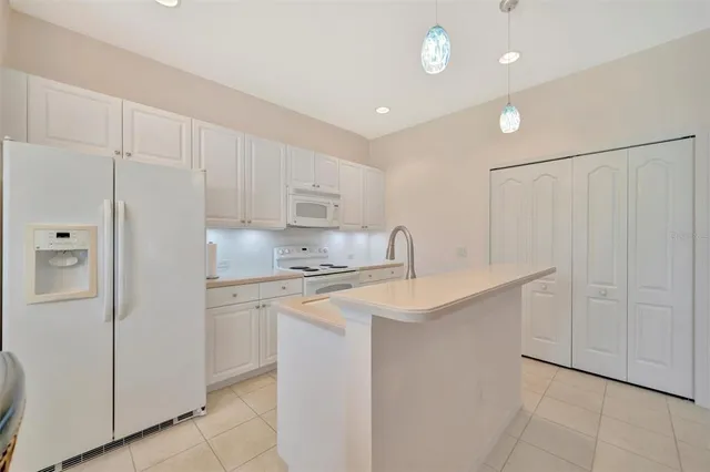 a bedroom with a bed and ceiling fan