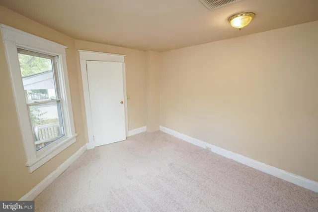 a white toilet sitting next to a bath tub
