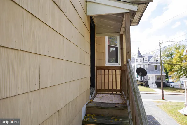 a kitchen with a refrigerator sink and cabinets