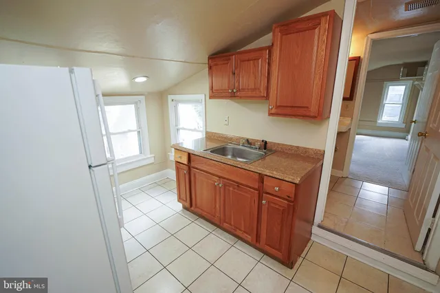 a kitchen with a window a stove a washer and dryer