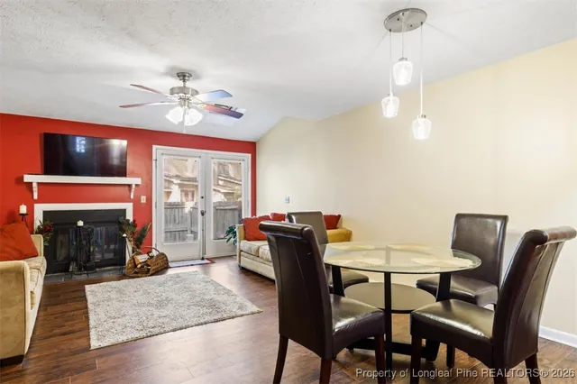 a view of a dining room with furniture wooden floor and chandelier