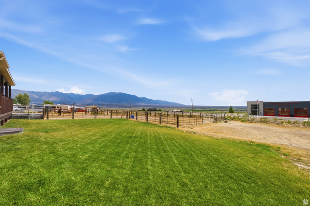 2567 West Rim Rock Drive Stockton, UT 84071 - Photo 49 of 64 Expansive green lawn with mountain backdrop