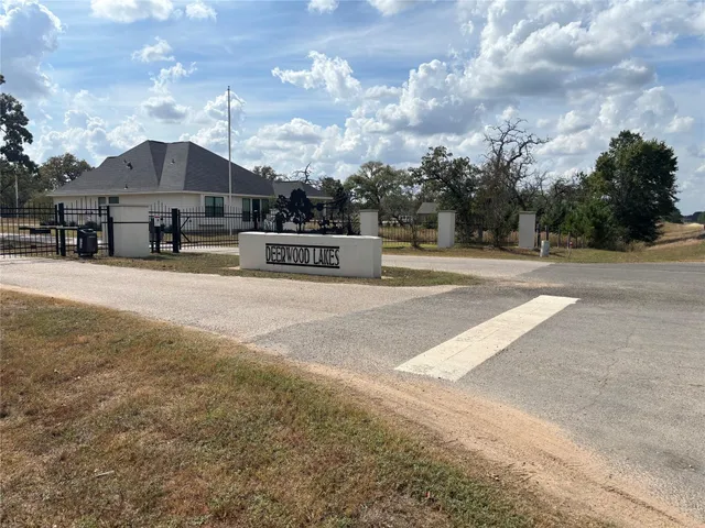 a view of a house with cars parked in front of house