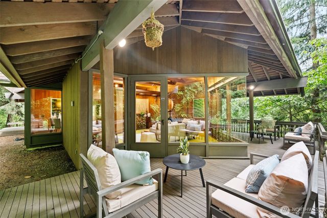 a balcony with furniture and outdoor view