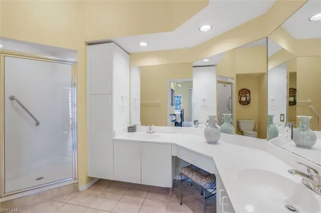 a bathroom with a double vanity sink mirror and double