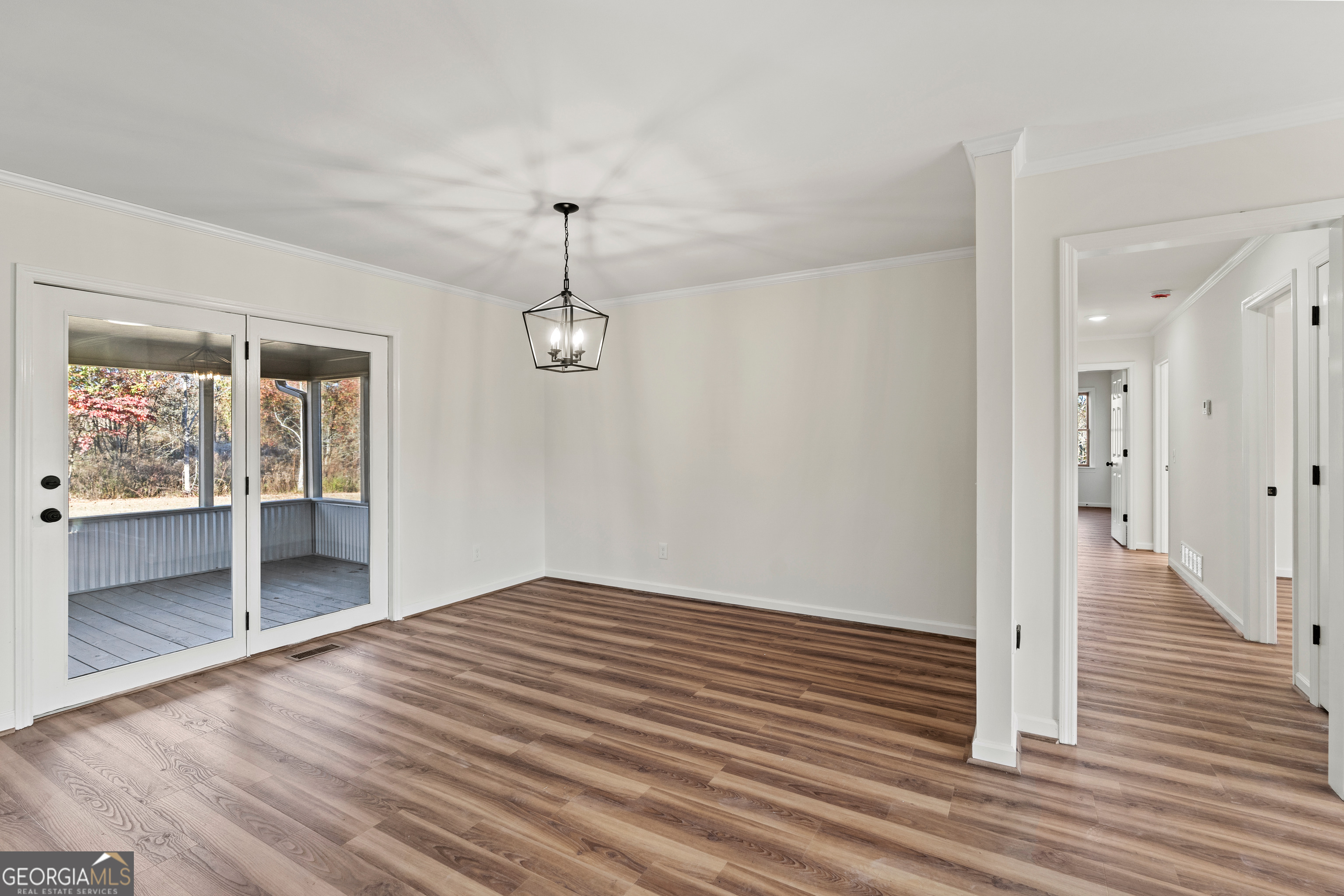 6421 Holly Springs Road Clermont, GA 30527 - Photo 26 of 58 a view of empty room with wooden floor and fan