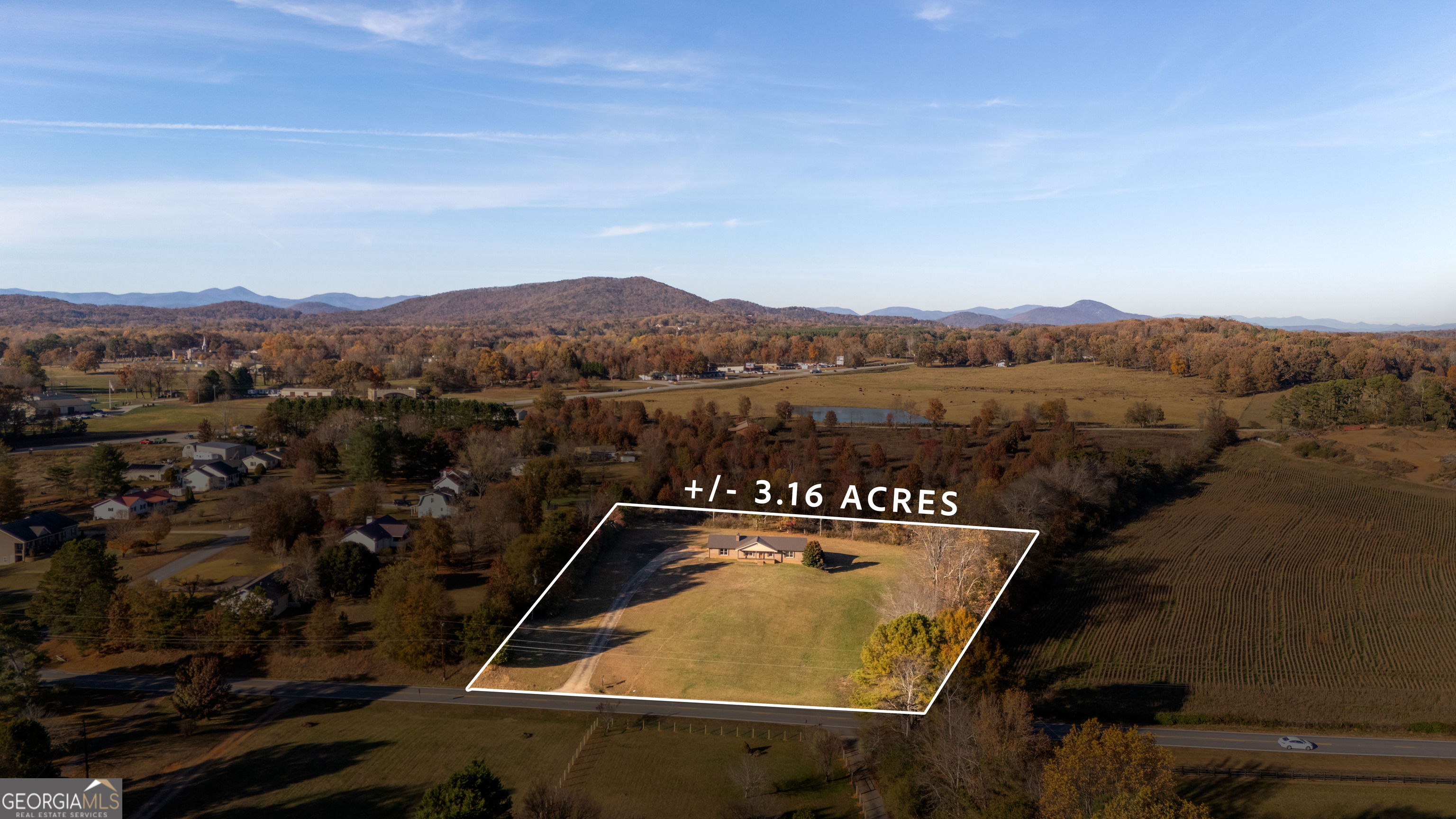 6421 Holly Springs Road Clermont, GA 30527 - Photo 4 of 58 an aerial view of residential house with outdoor space