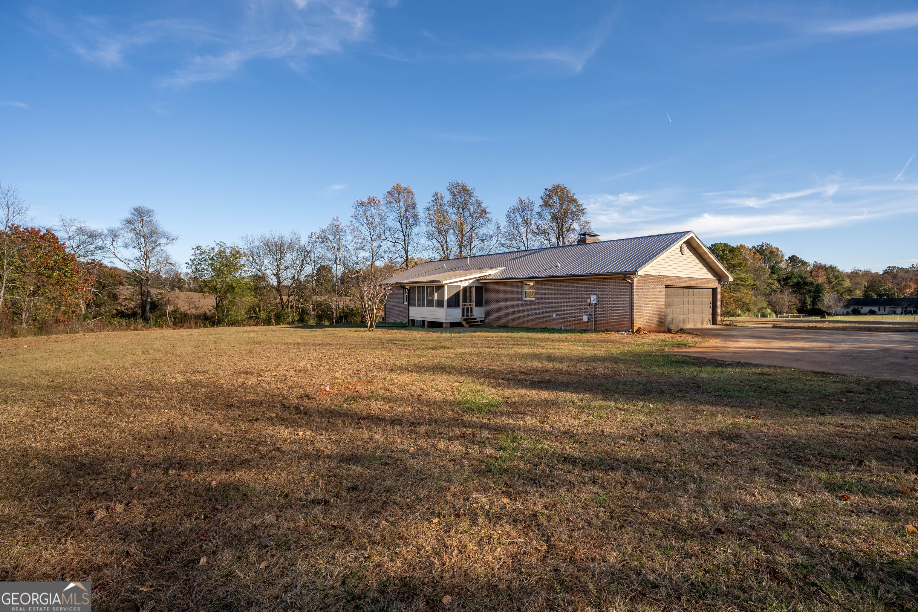 6421 Holly Springs Road Clermont, GA 30527 - Photo 9 of 58 a house view with a garden space