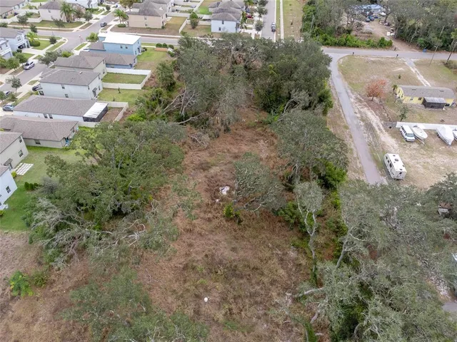 an aerial view of residential house with outdoor space
