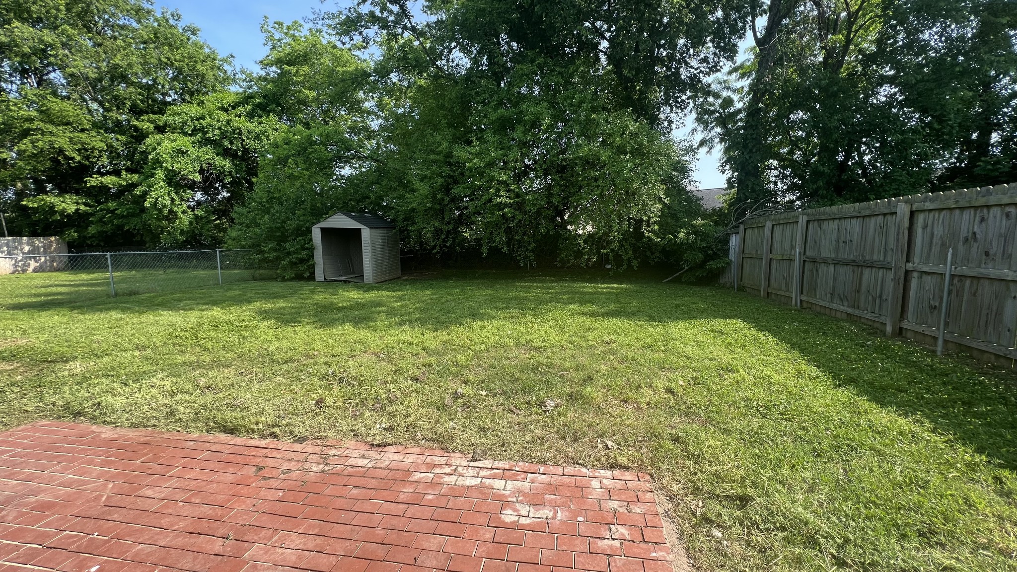 1047 Shadow Ridge Avenue Oak Grove, KY 42262 - Photo 14 of 15 a view of a backyard with a garden