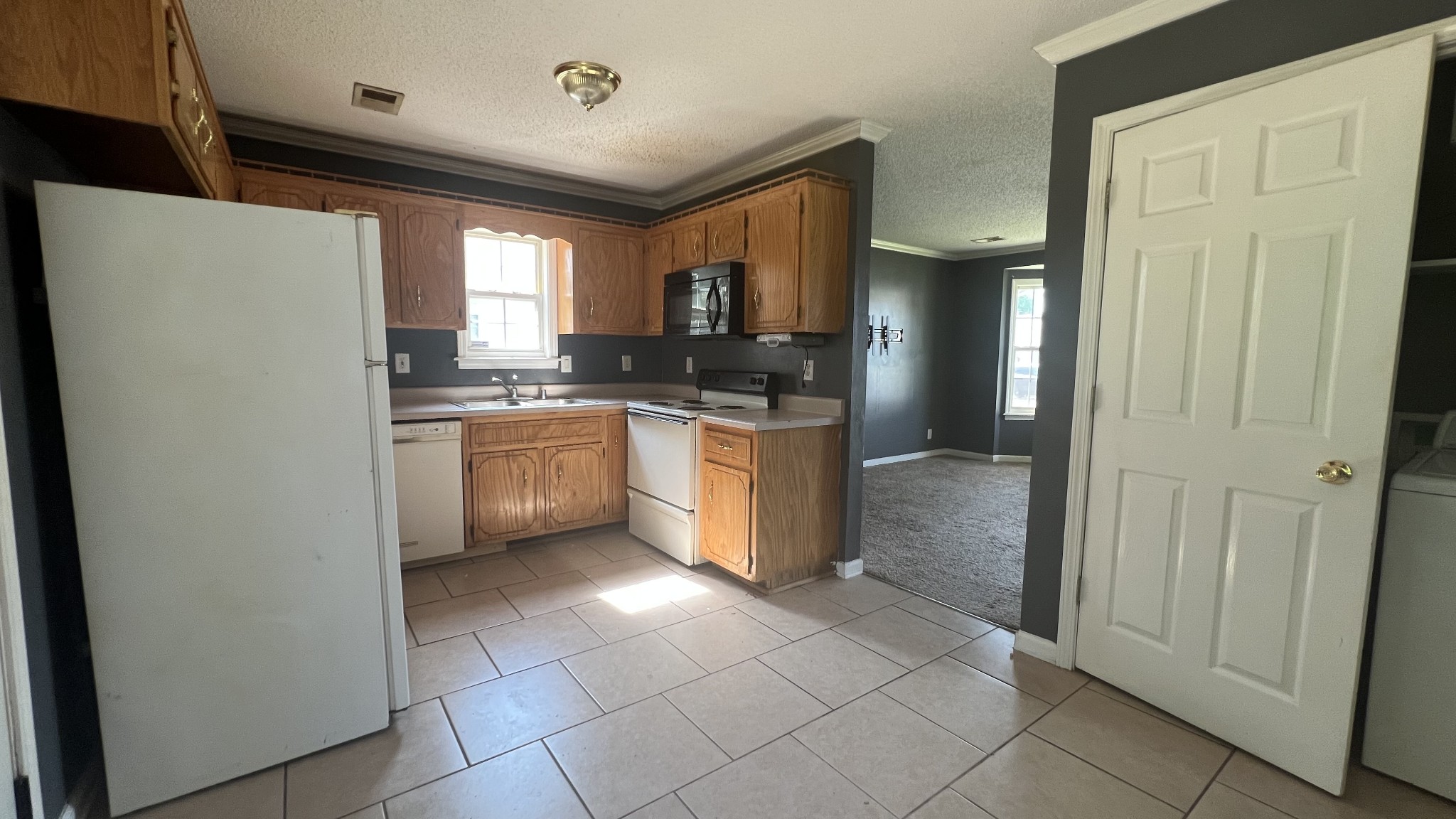 1047 Shadow Ridge Avenue Oak Grove, KY 42262 - Photo 8 of 15 a kitchen with stainless steel appliances granite countertop a sink stove and refrigerator