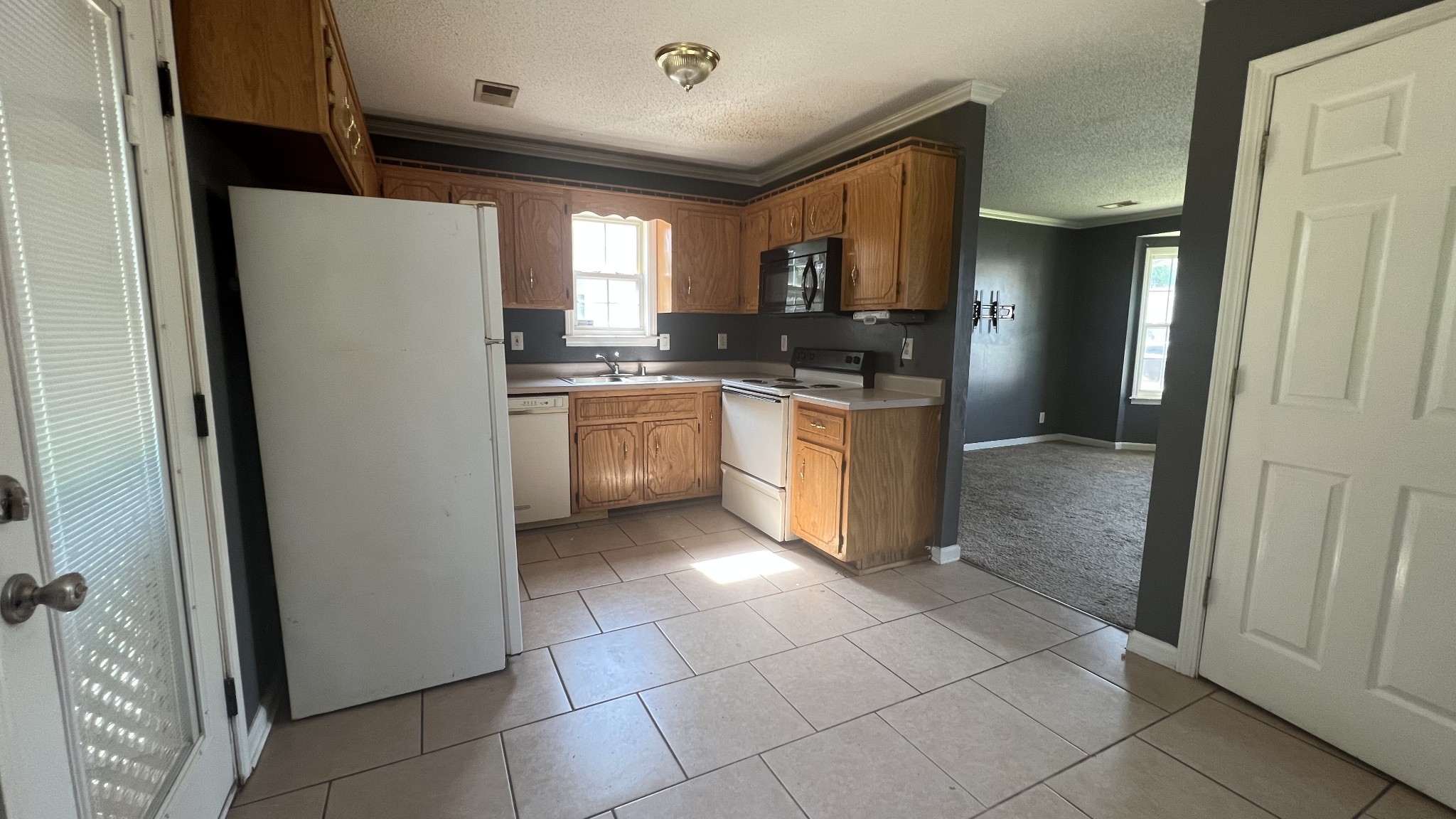 1047 Shadow Ridge Avenue Oak Grove, KY 42262 - Photo 9 of 15 a kitchen with stainless steel appliances granite countertop a refrigerator and a sink