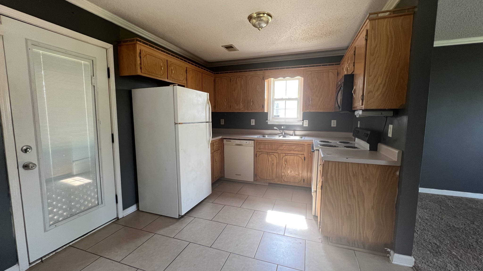 1047 Shadow Ridge Avenue Oak Grove, KY 42262 - Photo 10 of 15 a kitchen with a refrigerator sink and cabinets