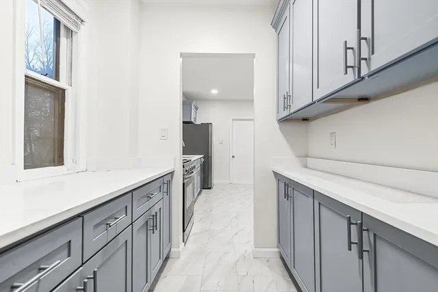 a kitchen with stainless steel appliances a sink and cabinets