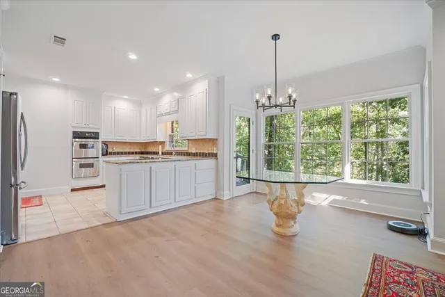 a living room with furniture and a rug