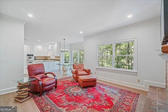 a living room with furniture fireplace and flat screen tv