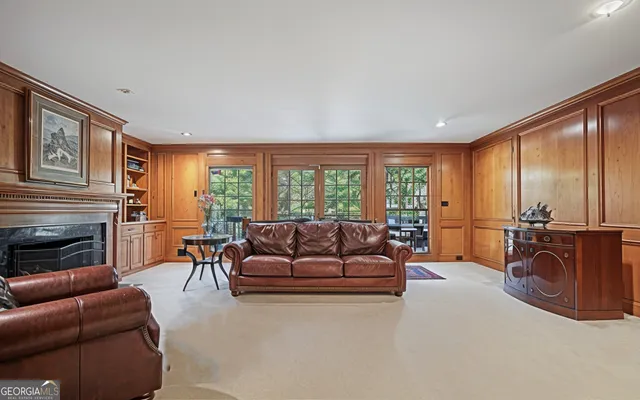 a spacious bedroom with a bed and a chandelier
