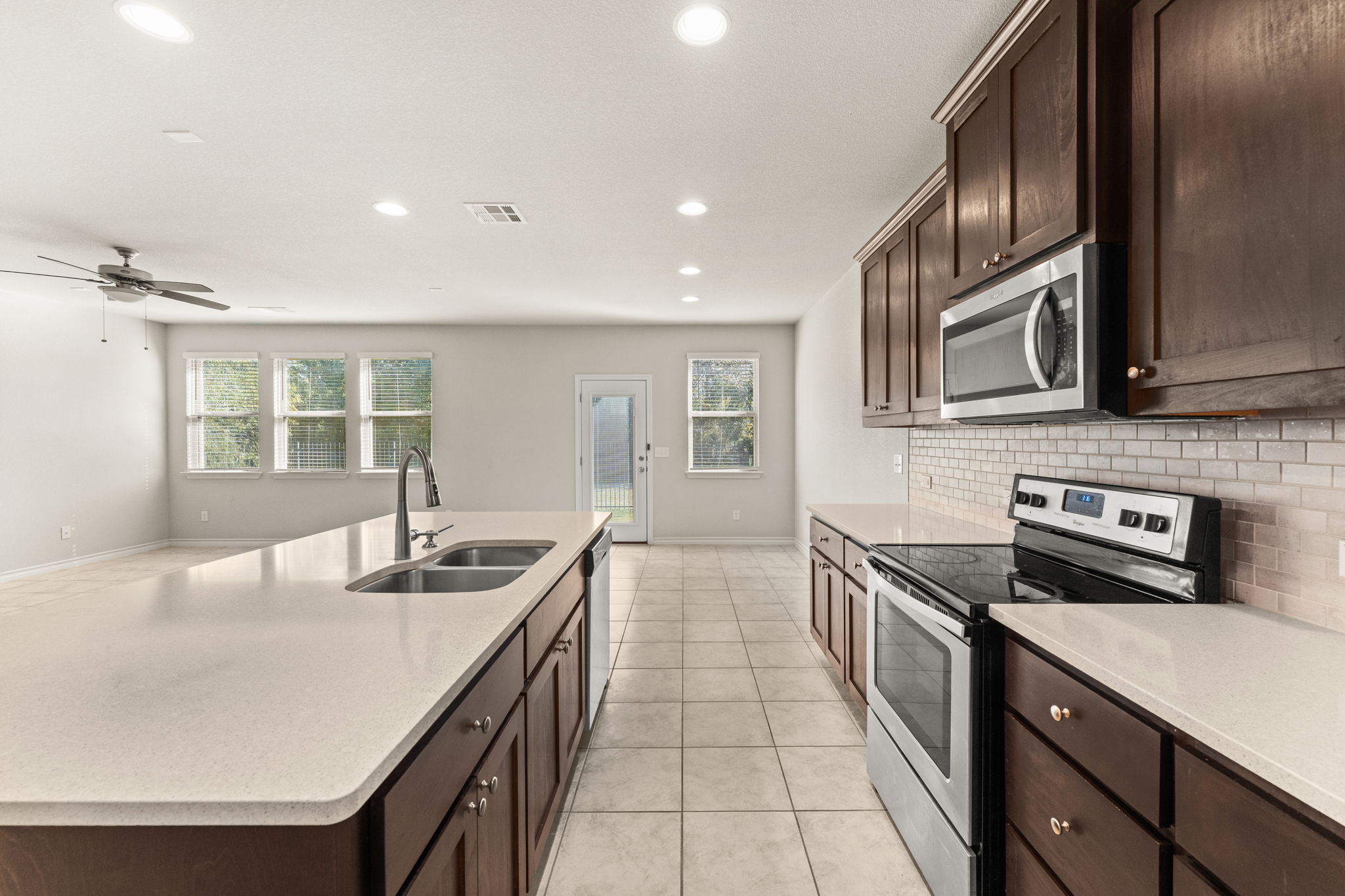 740 Aliso Trail Leander, TX 78641 - Photo 13 of 35 Stainless-steel appliances elevate the kitchen’s modern feel and functionality.