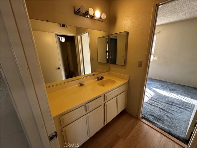 a view of a bathroom from a hallway