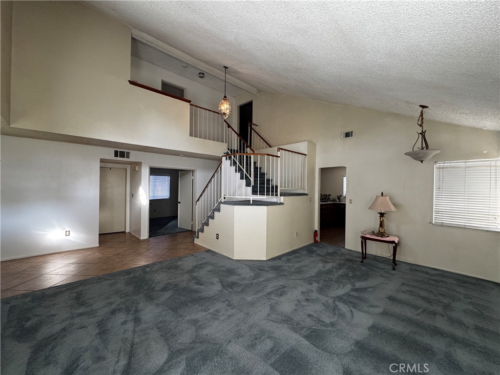 935 West Wabash Street Rialto, CA 92376 - Photo 4 of 17 a view of a livingroom with furniture and staircase