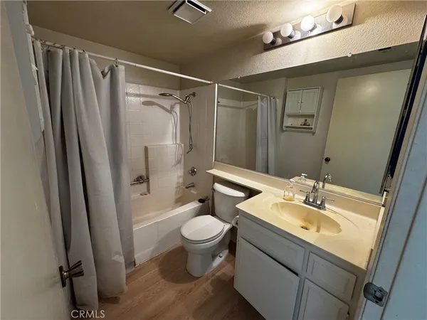 a bathroom with sink a mirror and shower