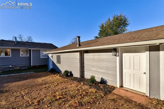a view of a roof deck with table and chairs with wooden floor and fence