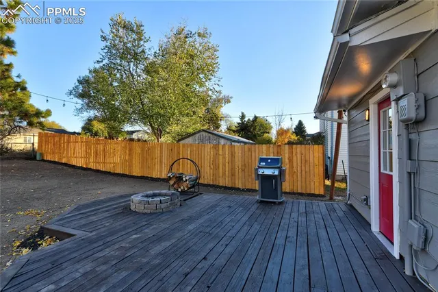 a view of a deck with wooden floor and seating space