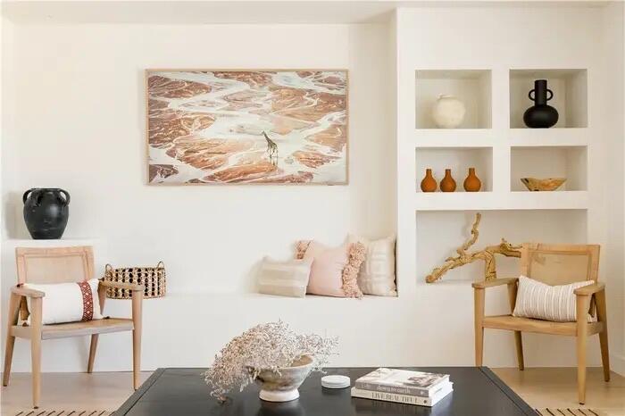 a view of a workspace with furniture and wooden floor