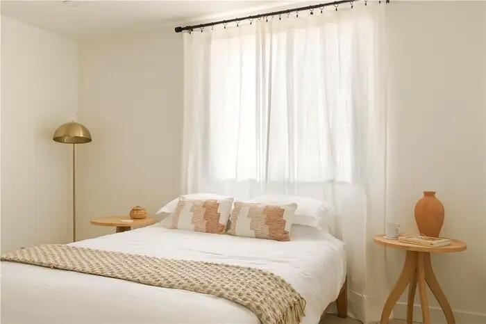 4622 Avenida La Mirada Joshua Tree, CA 92252 - Photo 18 of 22 a bedroom with a bed and a window