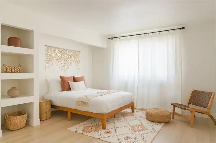 4622 Avenida La Mirada Joshua Tree, CA 92252 - Photo 7 of 22 a bedroom with a bed and chair