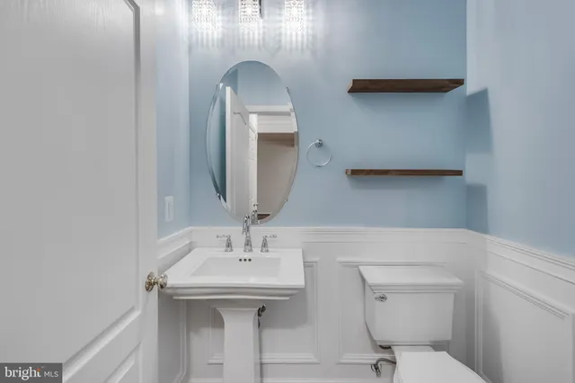an empty room with a ceiling fan and a window