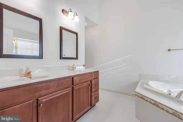 a spacious bathroom with a bathtub and a shower