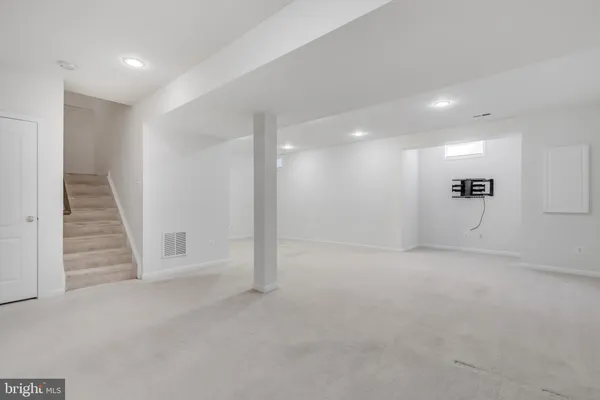 a bathroom with a toilet sink shower and mirror