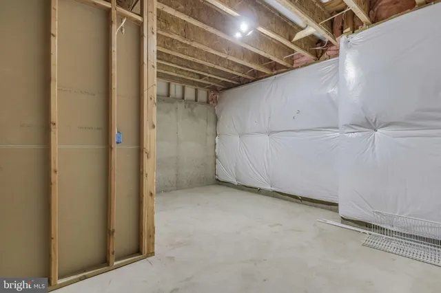 an aerial view of a house swimming pool and outdoor seating