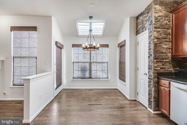a view of kitchen with furniture and a fireplace
