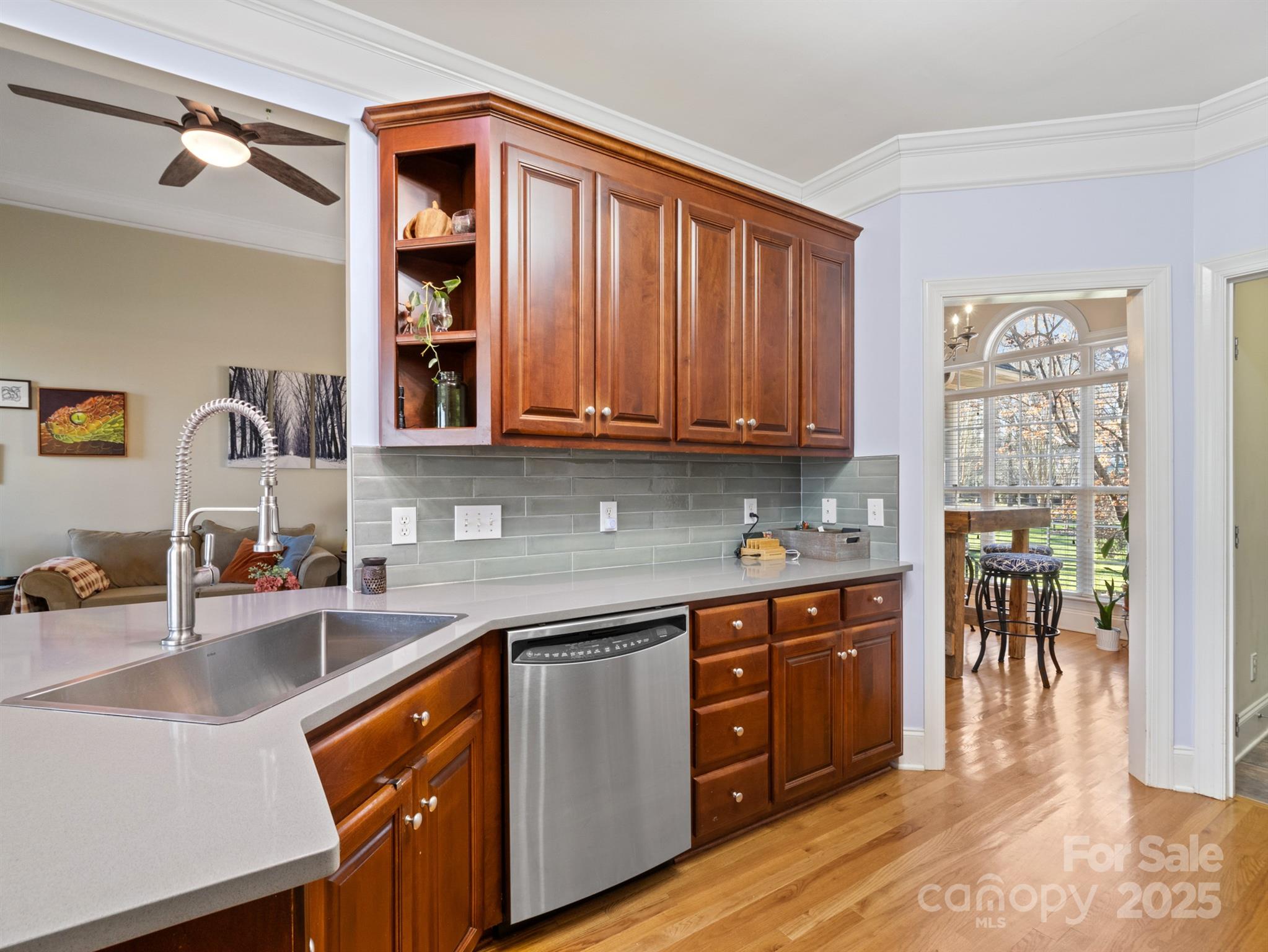 4739 Morris Glen Drive Concord, NC 28027 - Photo 12 of 40 a kitchen with stainless steel appliances granite countertop a sink and cabinets