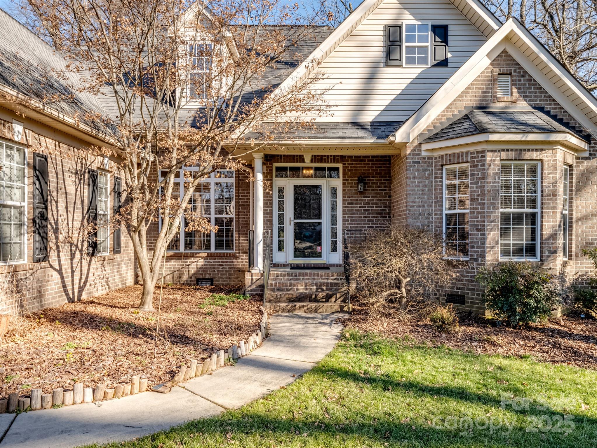 4739 Morris Glen Drive Concord, NC 28027 - Photo 2 of 40 a front view of a house with garden