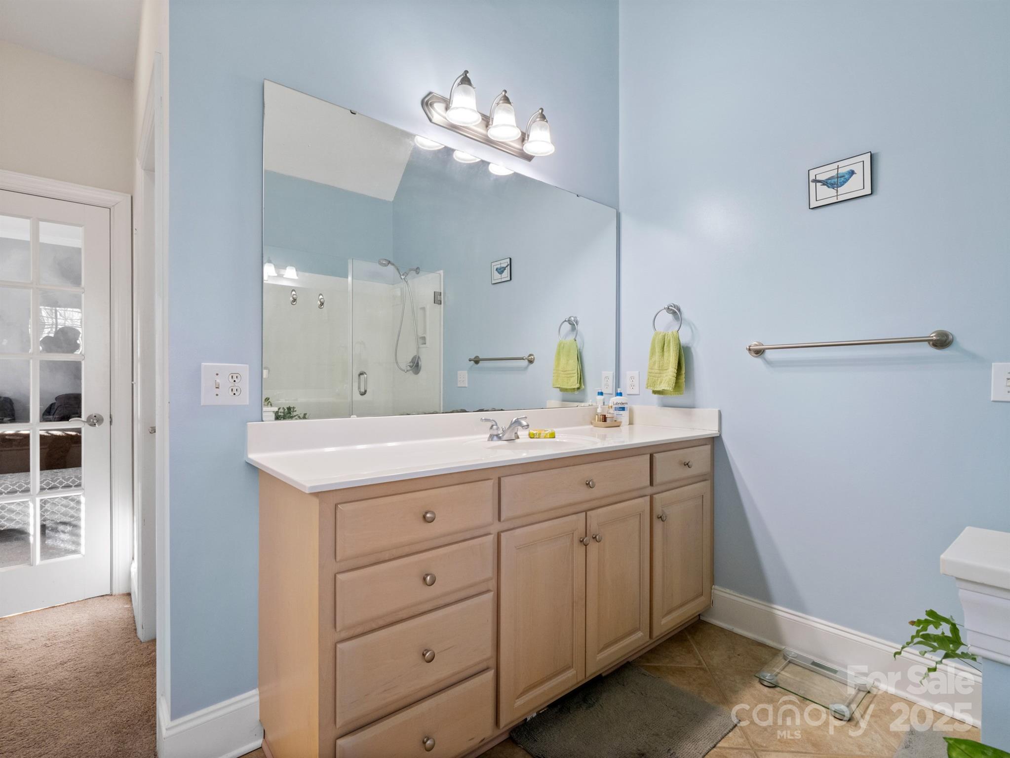 4739 Morris Glen Drive Concord, NC 28027 - Photo 21 of 40 a spacious bathroom with a granite countertop sink a mirror and a