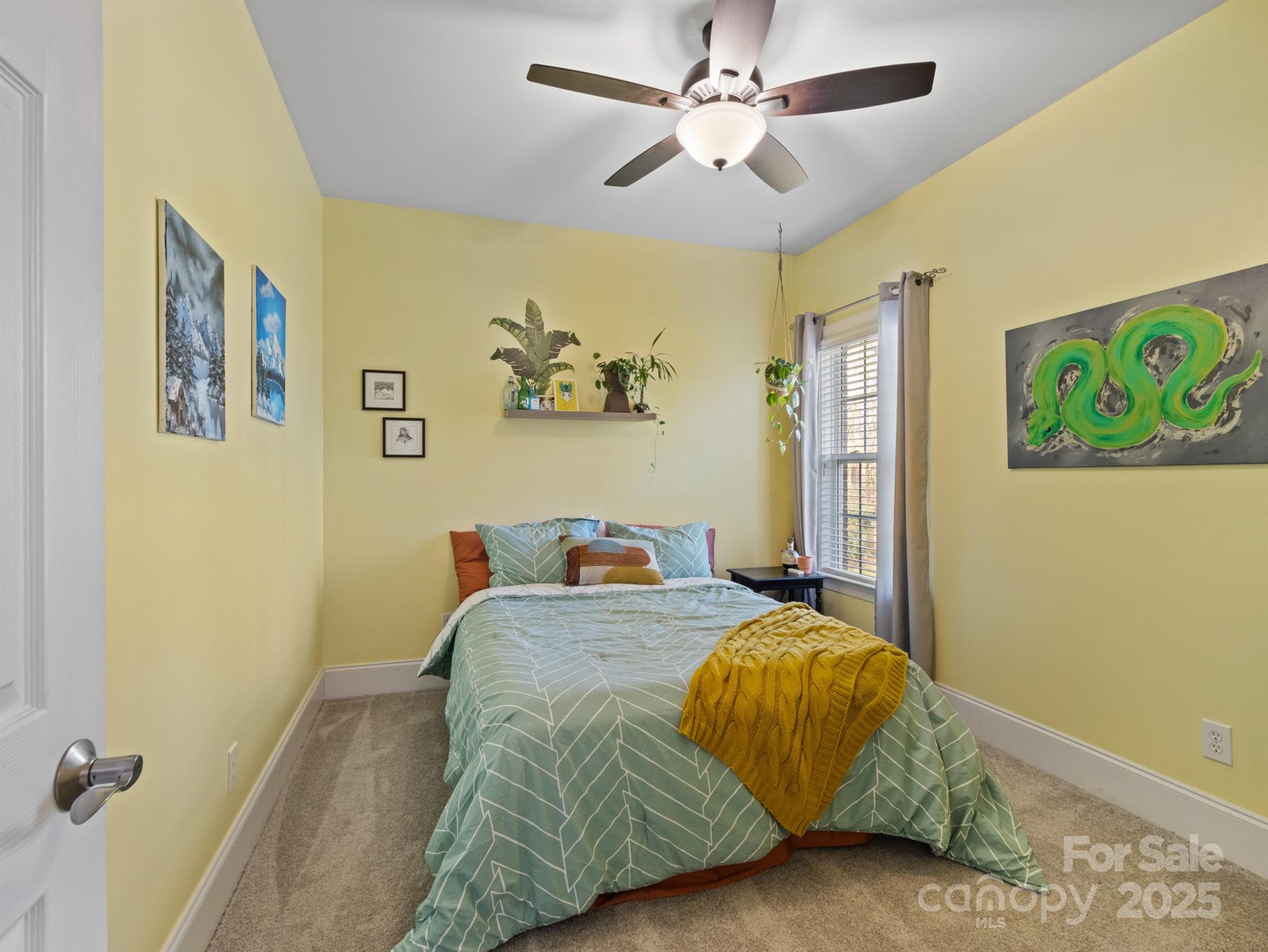 4739 Morris Glen Drive Concord, NC 28027 - Photo 24 of 40 a bedroom with a bed and a painting on the wall