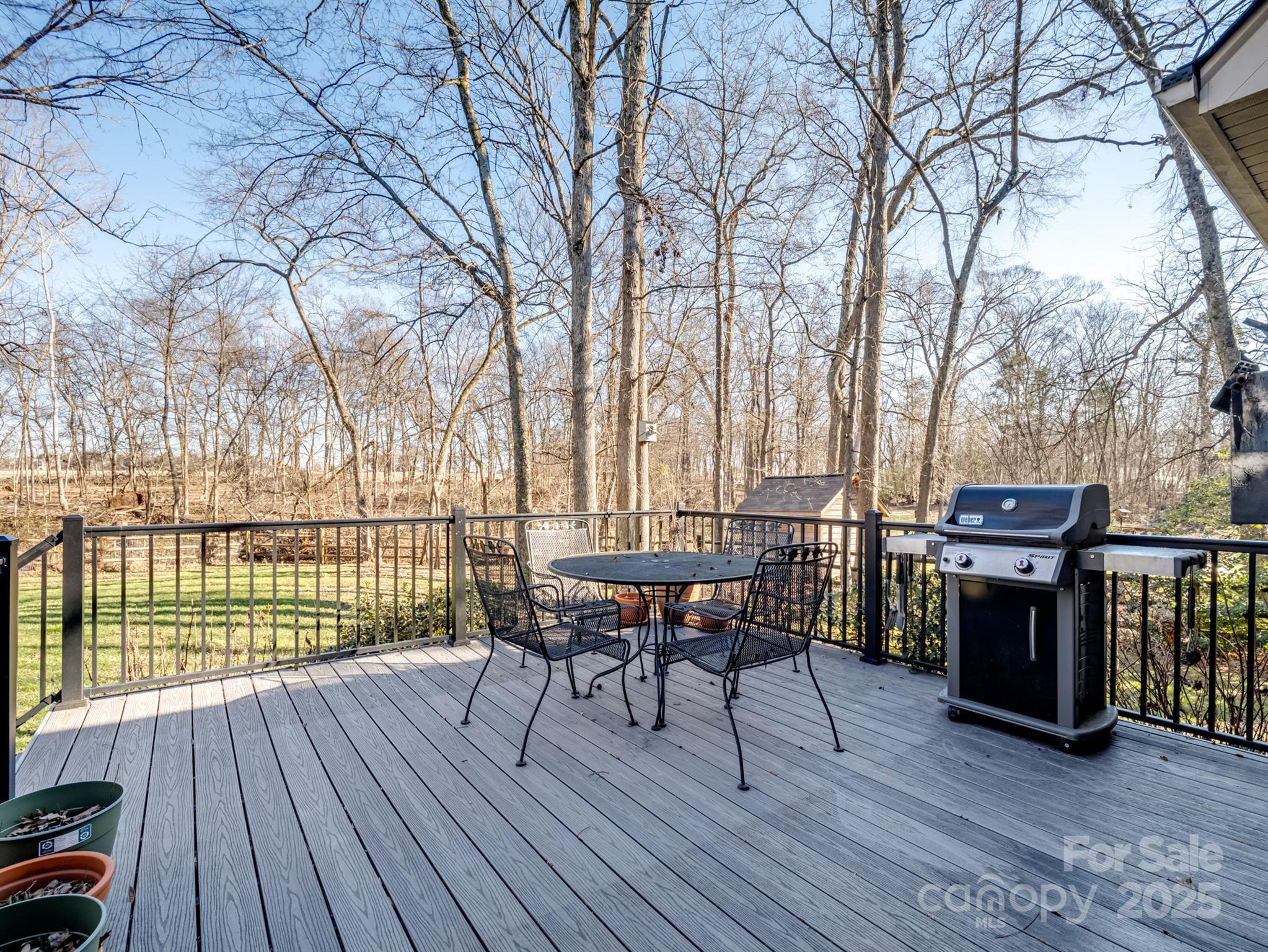 4739 Morris Glen Drive Concord, NC 28027 - Photo 30 of 40 a view of a chairs and table on the wooden floor