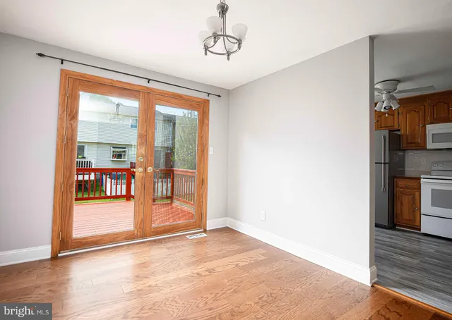 a view of an entryway with wooden floor