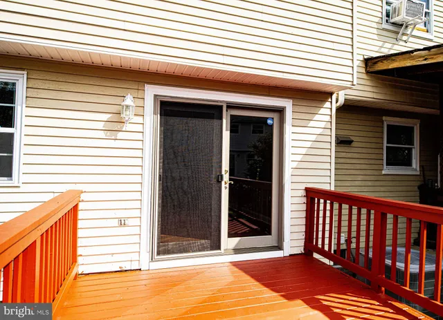 a view of a terrace with a door and a window