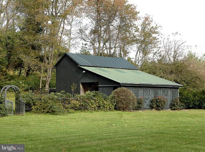 3892 Rectortown Road Marshall, VA 20115 - Photo 8 of 26 Equipment shed with fenced vegetable garden.