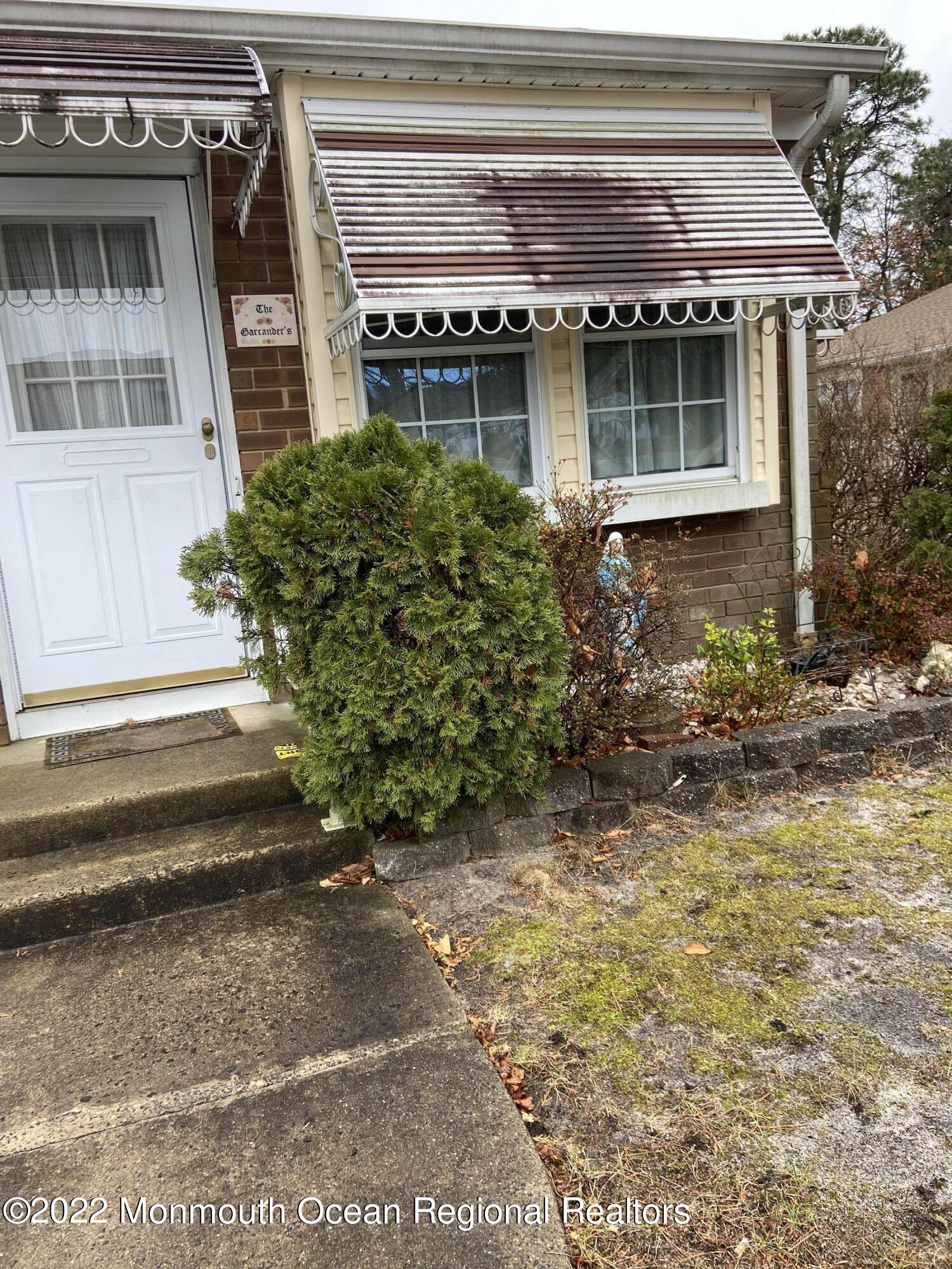 13 B Spring Street Whiting, NJ 08759 - Photo 3 of 14 a front view of a house with a yard