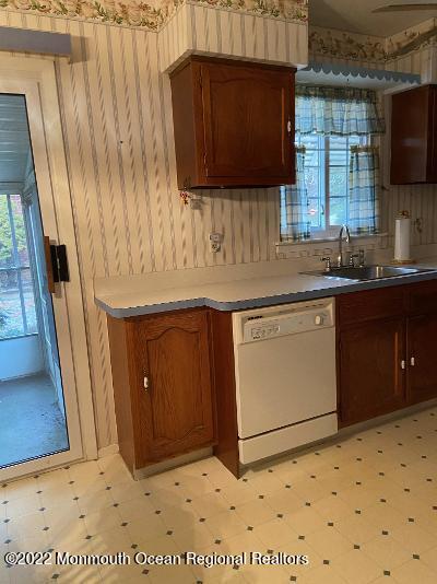 13 B Spring Street Whiting, NJ 08759 - Photo 6 of 14 a kitchen with a sink a stove and cabinets