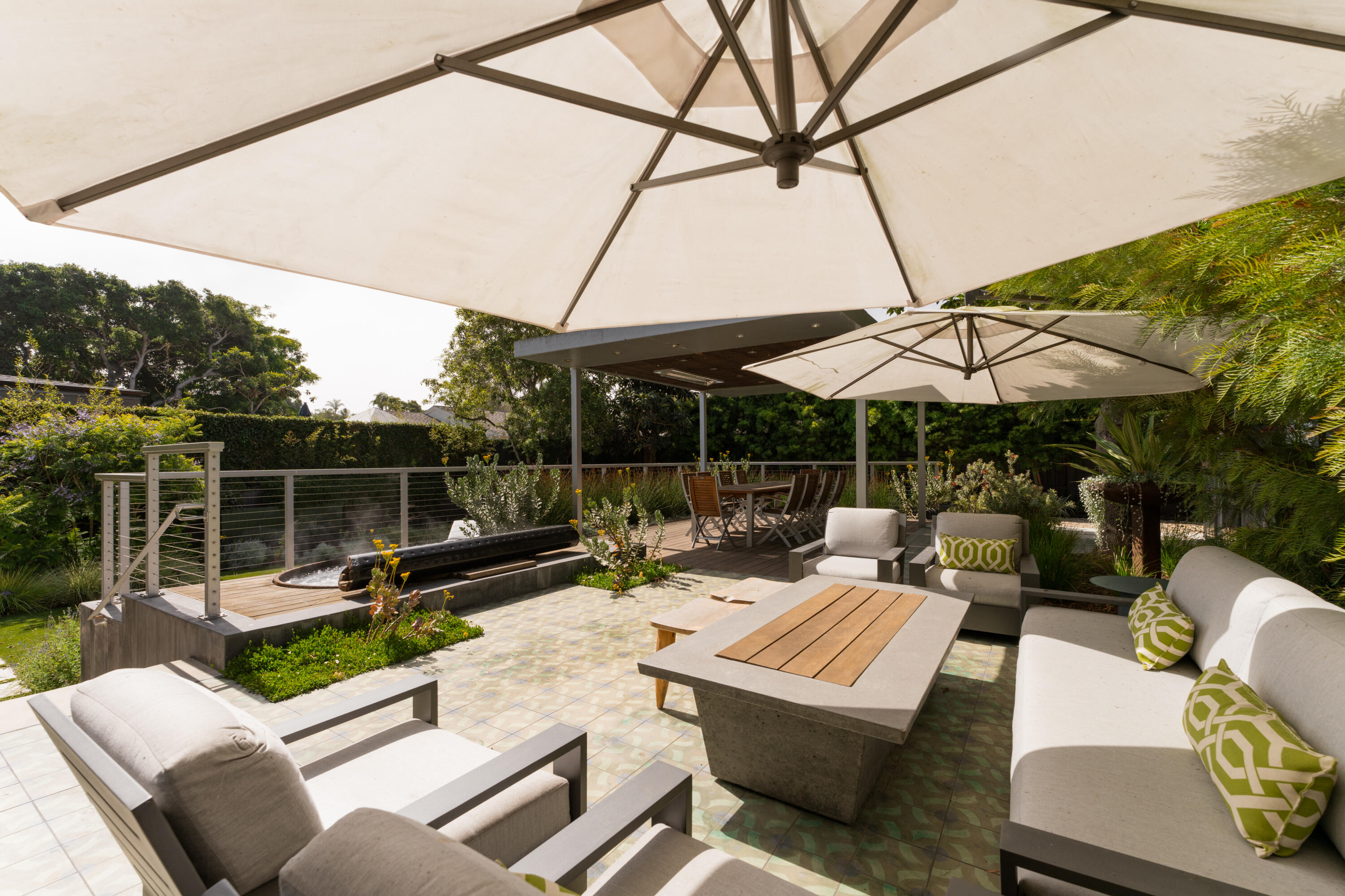 1365 Virginia Road Montecito, CA 93108 - Photo 31 of 38 a view of a patio with couches table and chairs under an umbrella