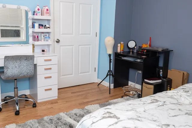 a bedroom with a bed and cabinets